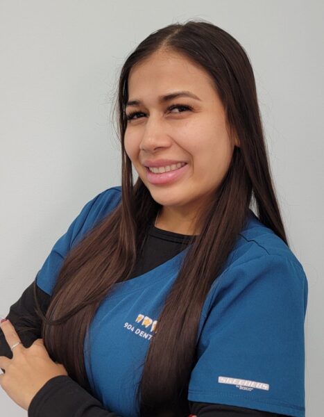 Smiling pretty girl in Scrubs. Anyu Dental Assistant at 904 Dental Care