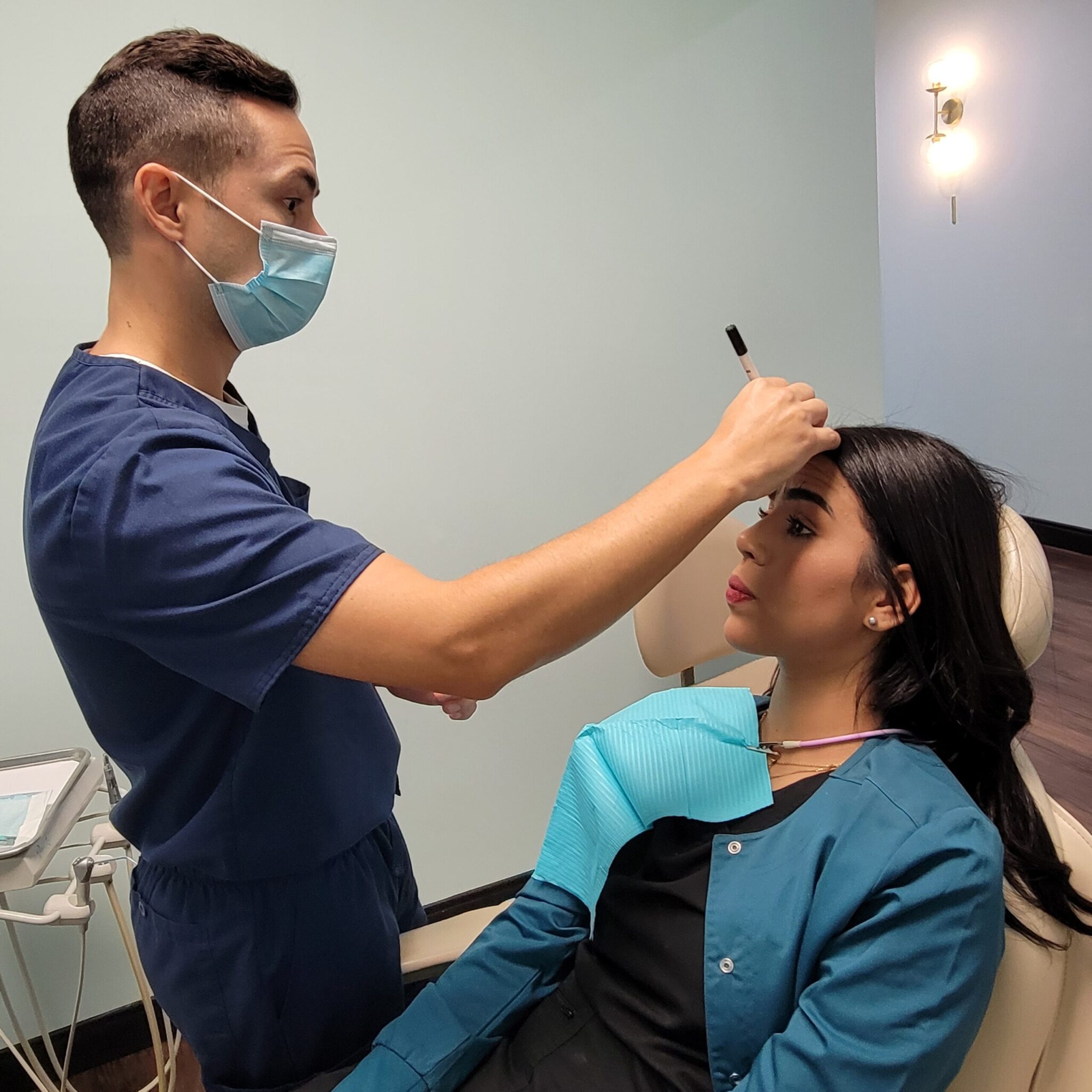 Dentist Dr Erminy preparing patient for Botox injection at 904 Dental Care