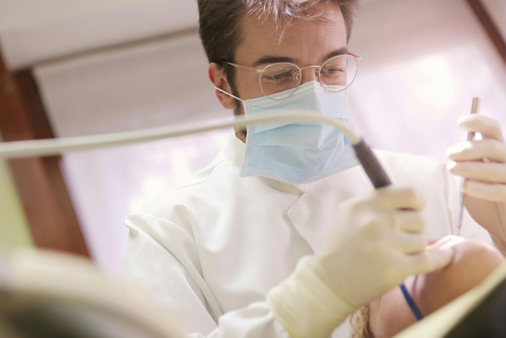 Male dental hygienist working